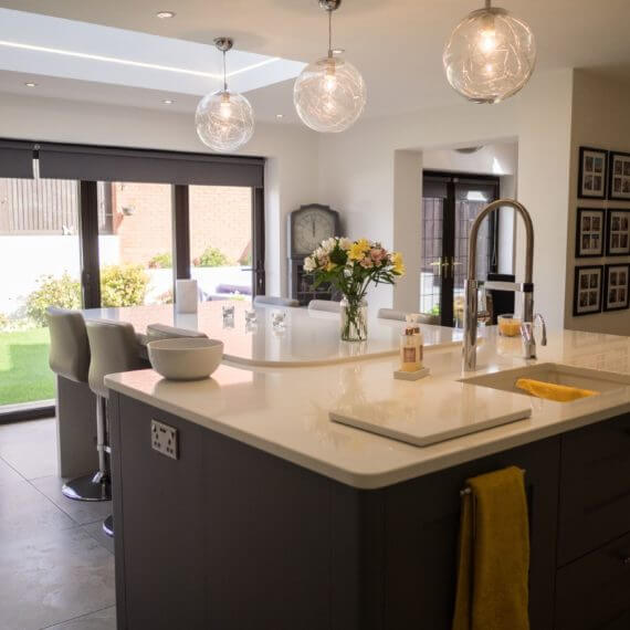 Painted Grey and Slate kitchen with white quartz worktop