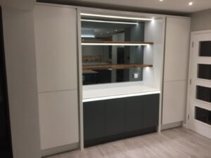 Grey mirrored glass splashback with shelving