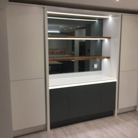 Grey mirrored glass splashback with shelving