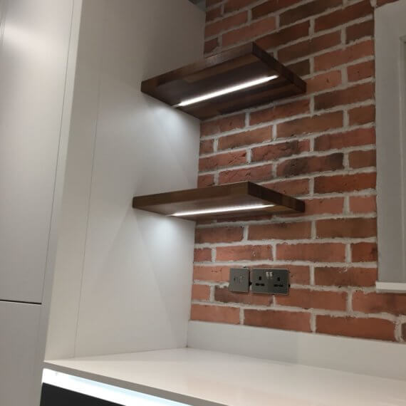 Wooden shelving with cool white strip lighting