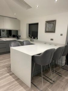 Light Grey and Dust Grey kitchen with quartz worktop downturn