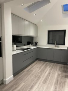 Light Grey and Dust Grey kitchen with mirrored splashbacks