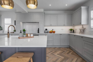 Light grey shaker kitchen and slate blue kitchen island