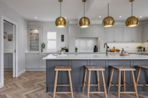Light grey shaker style kitchen with slate blue island