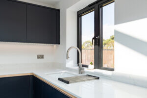 Indigo Kitchen with Quartz and Oak Worktops