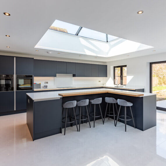 Indigo Kitchen featuring large l-shaped kitchen island